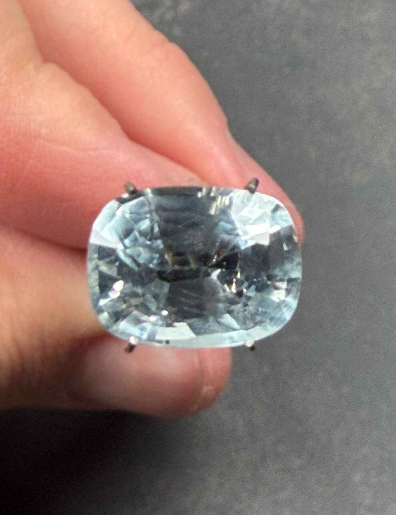 Pale blue cushion-cut loose gemstone from the River Basin Stoneworks catalog